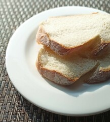 Wheat bread with white sugar on a plate ready to eat