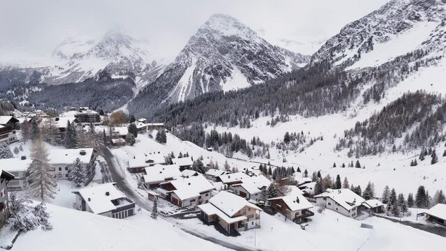 Arosa Switzerland, a famous tourist spot in Switzerland. Drone flight over town and valley in winter. 