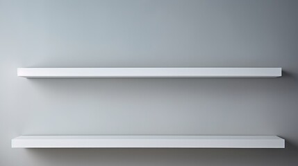 Two empty white shelves against a gray wall. Can be used for home decor or organizing purposes