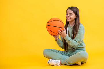 teen girl basketball player. childhood activity. Passionate about basketball sport. Teen sport...