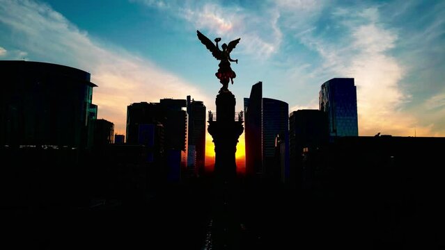 Aerial view Mexico city downtown angel de la independencia in reforma avenue, buildings at sunset 