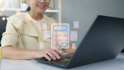 The concept of calculating taxes to be paid. Woman using computer to calculate tax through website and having headache paying taxes.