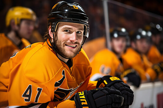 Smiling hockey player on the stands of a hockey stadium