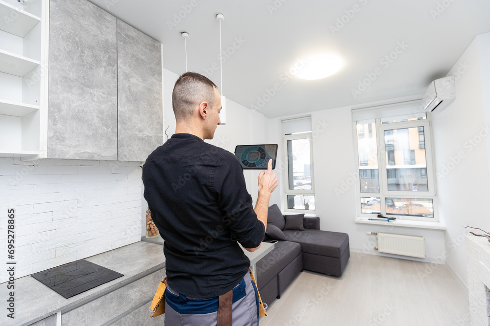 Aufkleber man using smart home security system control panel
