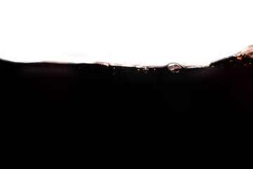 Black water or Coca Cola curved waves splashing, refreshing appearance for drinking.