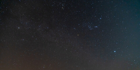 Fototapeta premium star in space with blur dark sky background at night