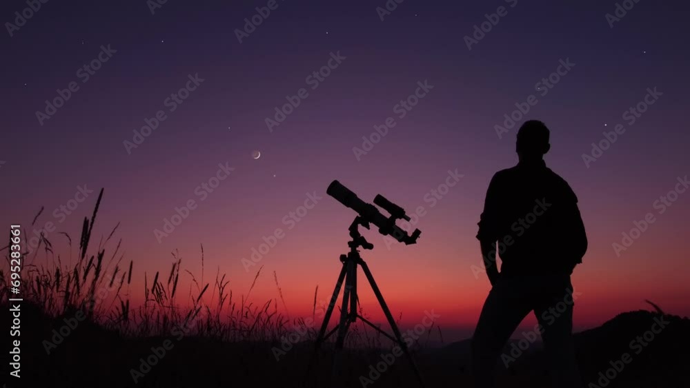 Wall mural astronomer looking at the stars, planets, moon and celestial objects with a telescope.