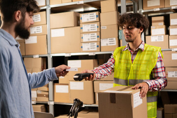 Hispanic man paying mail parcel paid with contactless nfc payment by credit card