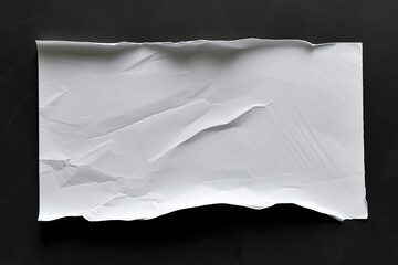 Obraz premium The title describes a detailed shot of a paper on a dark surface. This versatile asset is suitable for backgrounds, textures, office-themed designs, and minimalistic concepts.