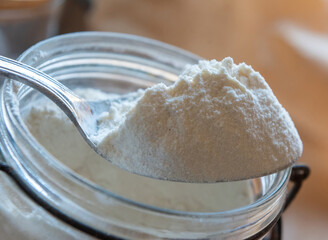 White flour in a spoon