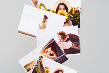 Printed colorful photos of women portraits against gray background