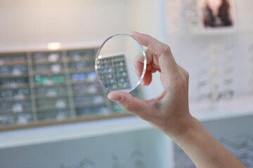 person using a glasses lenses 