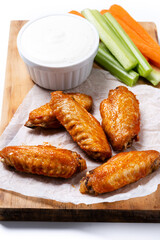 Buffalo spicy chicken wings with cayenne pepper sauce isolated on white background