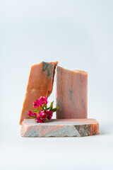 Polished granite stones with small flowers studio shot