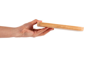 Wooden plate in hand on transparent background.