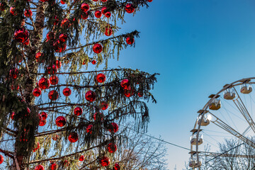 Ferris wheel at the Christmas market in Bergamo, Lombardy, Italy. Happy winter vacation feelings - obrazy, fototapety, plakaty
