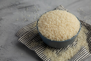 Dry Jasmine Rice in a Bowl, side view. Copy space.