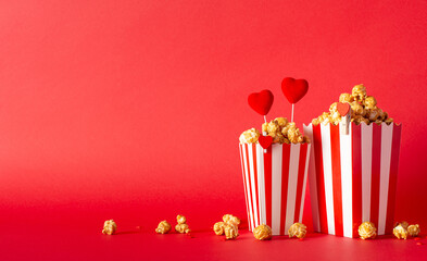 Love-filled theater launch on Valentine's. Side view unveils charming table featuring two striped...