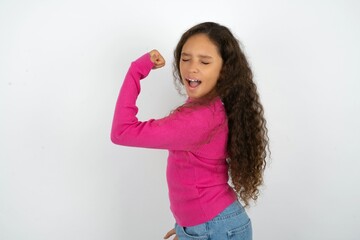 Portrait of funny Young beautiful teen girl shout yeah raise fists hands celebrate victory game...