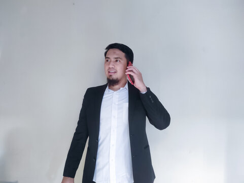 Asian business man is calling his colleague