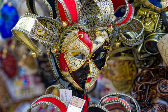 Close up of black and white carnival mask at City of Venice on a cloudy summer day. Photo taken August 6th, 2023, Venice, Italy.
