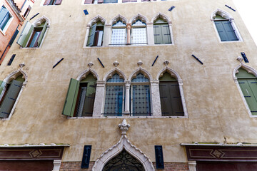Idyllic view of the old town of Italian City of Venice with close-up of facade of historic building...
