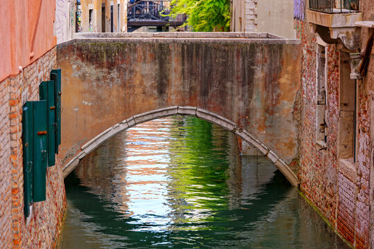 Old town of City of Venice with bridge over canal on a sunny summer day. Photo taken August 6th, 2023, Venice, Italy.