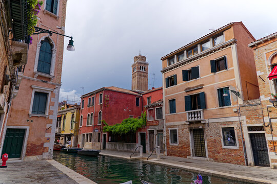 Old town of Italian City of Venice with canal and facades of historic houses on a summer day. Photo taken August 6th, 2023, Venice, Italy.