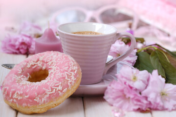 cup with drink coffee cappuccino, hot chocolate with milk, pink donut, scarf, sakura flowers,...