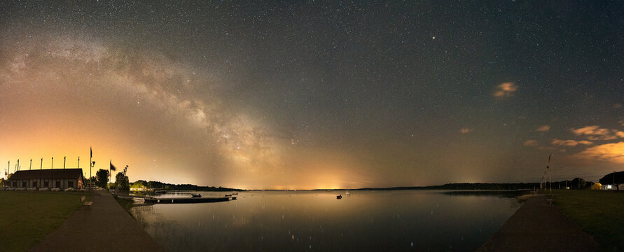 Panorama of the Milky Way with reflection on Lake Biscarosse passing above the Nautical base