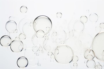 bubbles of varying sizes on white background  - obrazy, fototapety, plakaty