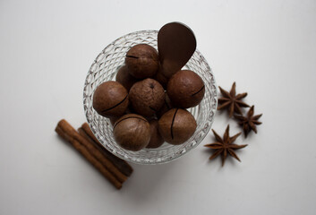 Macadamia nut with cinnamon and star anise close-up
