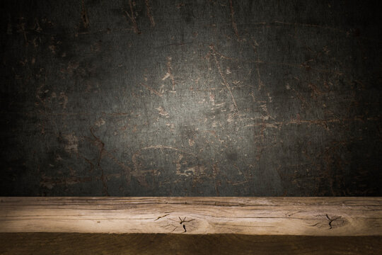 dark wall background. Empty workplace, in front of a package of abstracts.