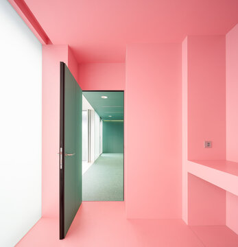 Pink room with open door in hospital