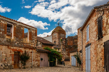 Medieval village of Auvillar and its clock tower, in Tarn et Garonne, Occitanie, France - 695338299