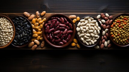 Top view low key of a large variety of dry beans.