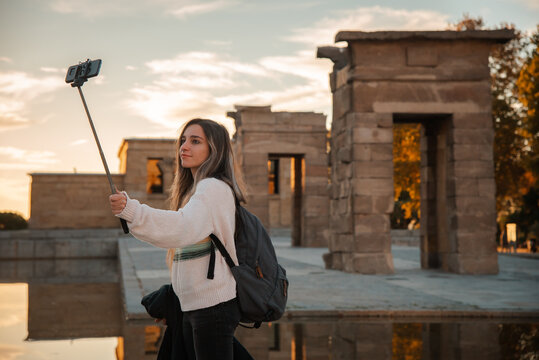 Young traveler taking a selfie at historical Debod Temple in Madrid