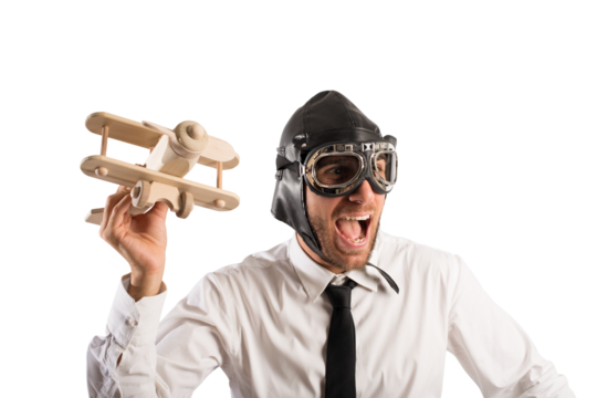 Businessman playing with a wooden aircraft. Concept of startup of a new company