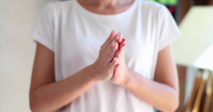 Female hands massage palms closed and nervous gesture. Emotions of expectation