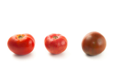 Assort of different color tomatoes isolated on white background with clipping path. .