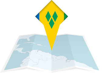 Saint Vincent and the Grenadines pin flag and map on a folded map - obrazy, fototapety, plakaty