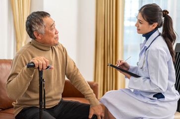 Obraz premium Portrait of smiling caring asian doctor service help support discussing and consulting taking care, caring, caregiver with senior elderly asian man at home visit.senior retirement home care