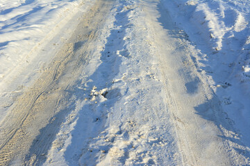 Fototapeta premium snowy road with tire track isolated 