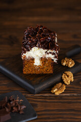 Dessert carrot cake with vanilla cream cheese, chocolate and walnuts.