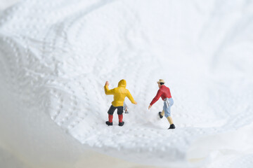 mountaineers in action, white snow landscape, miniature figures scene,
