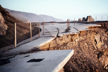 Archival 1980s view of collapsed storm damaged section of Pacific Coast Highway north of Malibu at...