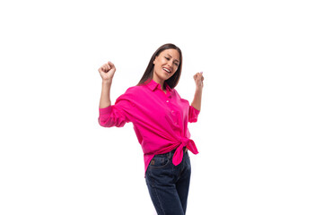 Obraz na płótnie Canvas young successful brunette female leader wears bright pink shirt tied at the waist