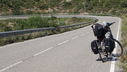 Obraz premium A bicycle on the road between Peramola and Politg in Catalonia, in the month of July