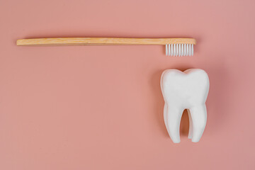 Tooth and eco tooth brushes on a beige background. Concept of dental examination of teeth, health and dental hygiene. Prevention of caries and tartar teeth. - obrazy, fototapety, plakaty