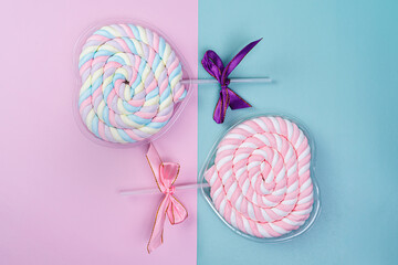Sweet lollipops on a colored background. Valentine's day, birthday.